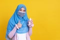 Muslim Asian woman with traditional dress wearing medical face mask Royalty Free Stock Photo