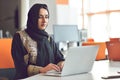 Muslim asian woman working in office with laptop