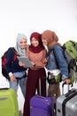 Muslim asian woman friend sitting in airport terminal Royalty Free Stock Photo