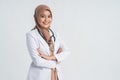 Muslim beautiful female doctor in white coat with stethoscope