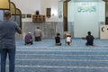 Muslim believers pray in prayer room of the Ahmadiyya Shaykh Mahmud mosque in Haifa city in Israel