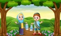 Muslim boy and girl cartoon holding lantern in the jungle Royalty Free Stock Photo