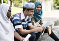 Muslim boy and girls studying outdoor