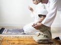 Muslim boy learning how to make Dua to Allah Royalty Free Stock Photo