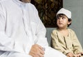 Muslim boy learning how to Salah