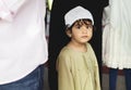 Muslim boy at the mosque with his family