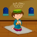 Muslim boy offering namaaz on Eid for Ramadan background Royalty Free Stock Photo
