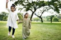 Muslim brother and sister playing in the park Royalty Free Stock Photo