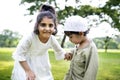 Muslim brother and sister playing in the park Royalty Free Stock Photo