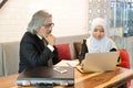 Muslim business people having meeting with businesswoman using laptop computer Royalty Free Stock Photo