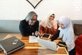 Muslim business people having meeting with businesswoman using laptop computer and tablet Royalty Free Stock Photo