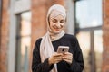 Muslim business woman talking on mobile phone outdoors Royalty Free Stock Photo