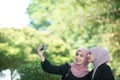 Muslim Business Women taking a Selfie.