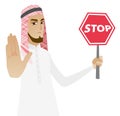 Muslim businessman holding stop road sign.