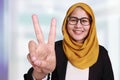 Muslim Businesswoman Showing Number Two Victory Gesture Royalty Free Stock Photo