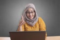 Muslim Businesswoman Working on Laptop at the Office, Thinking Gesture Royalty Free Stock Photo