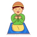 a Boy Sitting on Prayer Mat