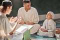 Muslim child, mosque and quran with teacher for spiritual learning, development or growth on carpet. Islamic teaching