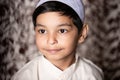 Muslim Child Wearing Muslim cap and Dress