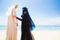 Muslim couple on a beach