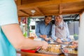 muslim couple enjoy having iftar dinner at traditional food stall Royalty Free Stock Photo