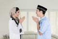 Muslim couple forgiving each other at home Royalty Free Stock Photo