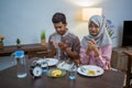 muslim couple having breakfast or sahur early morning