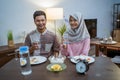 muslim couple having breakfast or sahur early morning