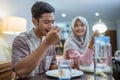 muslim couple having breakfast or sahur early morning