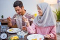 muslim couple having breakfast or sahur early morning