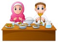 Muslim couple pray together before break fasting