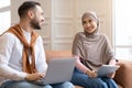 Muslim Couple Using Computers Laptop And Digital Tablet At Home Royalty Free Stock Photo