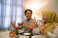 muslim couple waiting adhan to break the fast Royalty Free Stock Photo