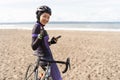 muslim cyclist with hijab showing thumb up while riding Royalty Free Stock Photo