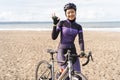 muslim cyclist with hijab showing thumb up while riding Royalty Free Stock Photo