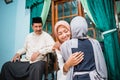 muslim daughter kneel and shake their parent& x27;s hand asking for forgiveness