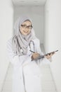 Muslim doctor with clipboard in the hospital corridor Royalty Free Stock Photo