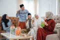 Muslim families get together celebrating Idul Fitri by at home