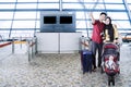 Muslim family with baby in the airport terminal