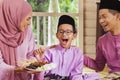 Muslim family feasting during the Eid celebration Royalty Free Stock Photo