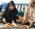 Muslim family having dinner on the floor Royalty Free Stock Photo