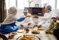 Muslim family having dinner on the floor