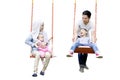 Muslim family having fun on swing Royalty Free Stock Photo