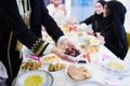 Muslim family having Iftar dinner eating dates to break feast Royalty Free Stock Photo
