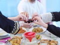 Muslim family having Iftar dinner eating dates to break feast Royalty Free Stock Photo