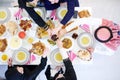 Muslim family having Iftar dinner eating dates to break feast top view Royalty Free Stock Photo