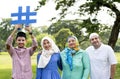Muslim family holding up a hashtag Royalty Free Stock Photo