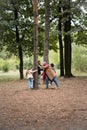 Muslim family playing near trees in autumn park,stock image Royalty Free Stock Photo