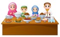 Muslim family pray together before break fasting