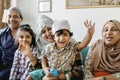 Muslim family relaxing and playing at home Royalty Free Stock Photo